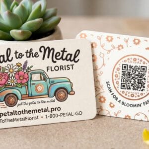 Professional business card mockup featuring a stack of matte cards for "Petal to the Metal Florist" with a vintage truck logo, QR code, and a succulent in a pot.